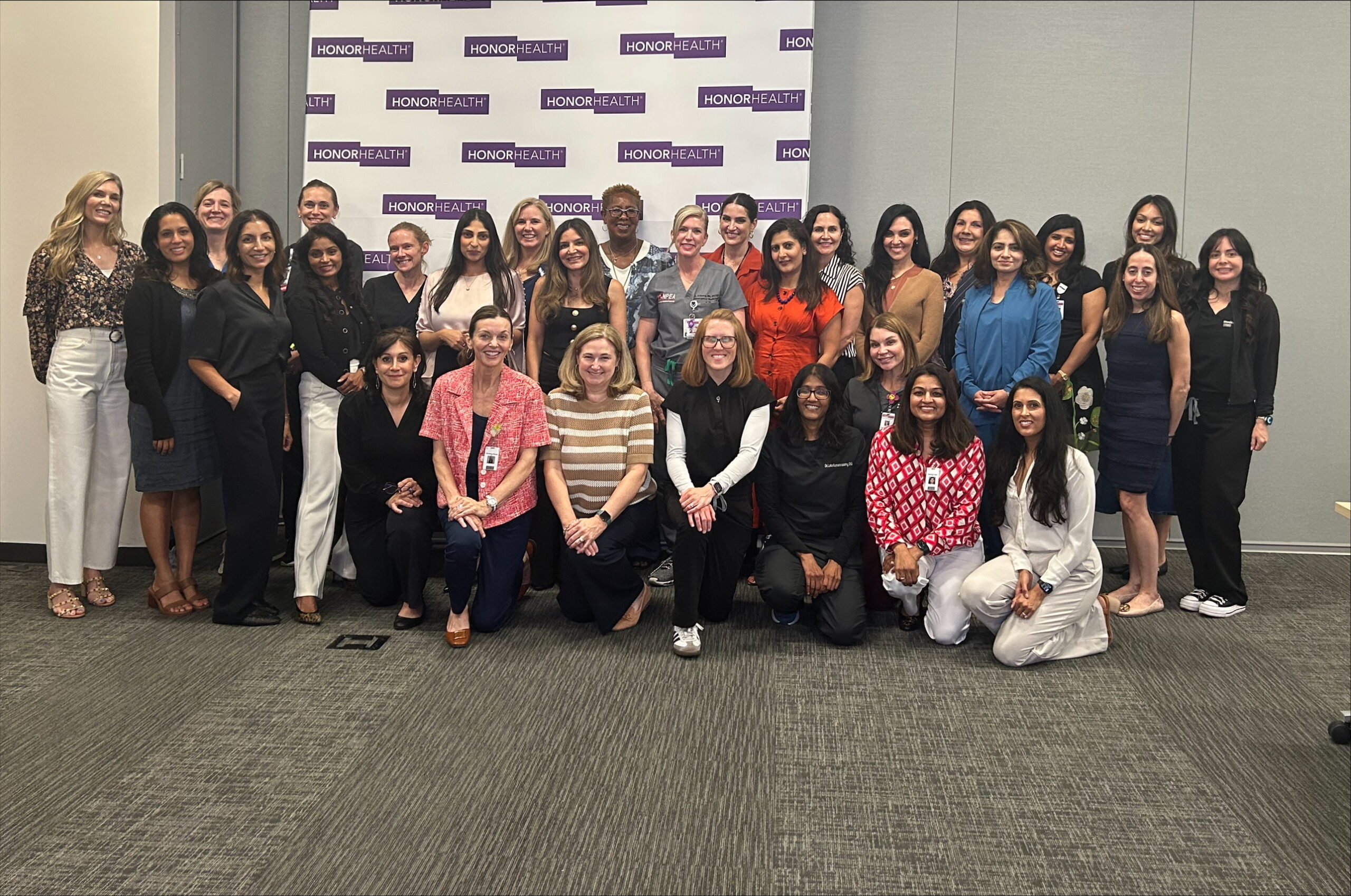 Group of women providers gathered to celebrate women in medicine. 