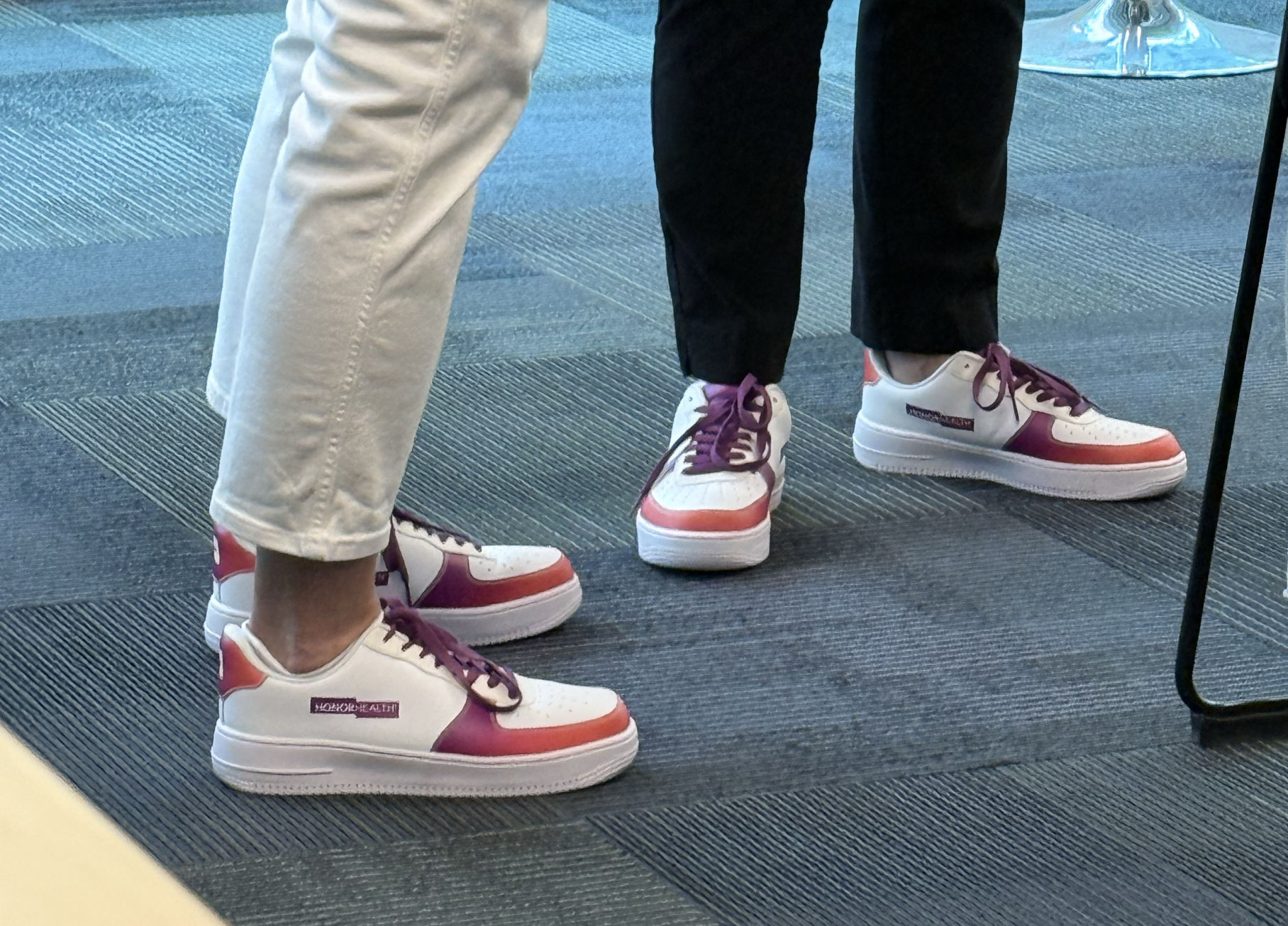 Two people standing with HonorHealth branded nikes
