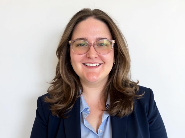 Headshot of Randi Flynn with navy blue suit and blue top.